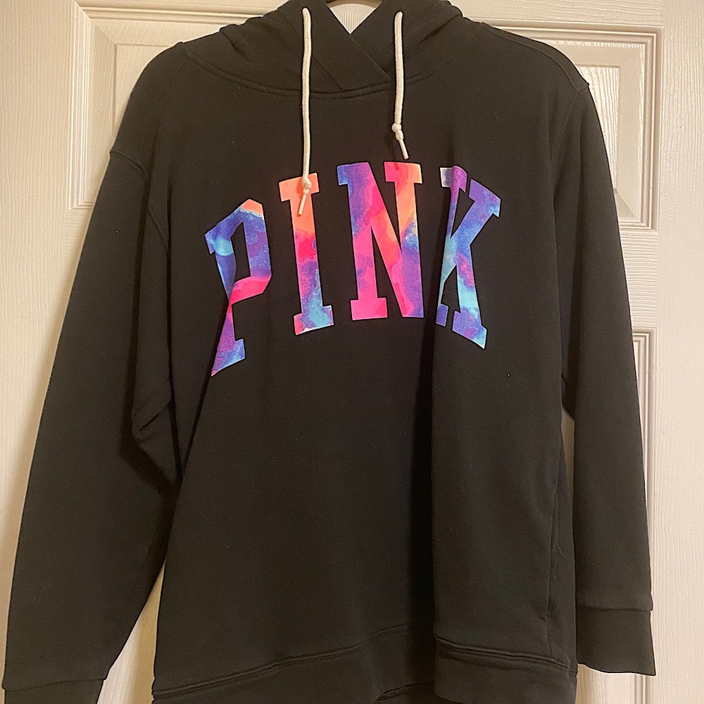 Black hoodie with colorful logo.